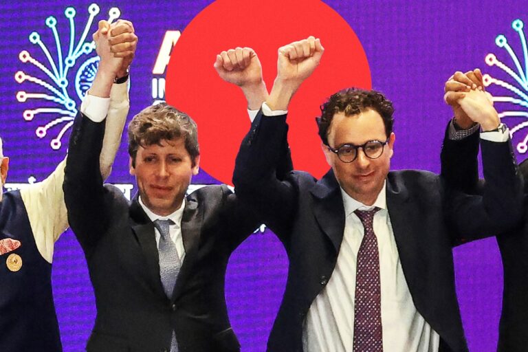 Skin-Crawlingly Awkward Video Shows Sam Altman and Dario Amodei Refusing to Hold Hands